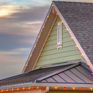 Roof,With,Christmas,Lights,Against,Cloudy,Sky